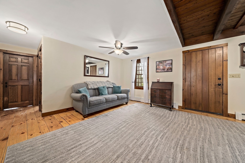 372 Winter Street Walpole, MA 02081 - Photo 12 of 42 a living room with furniture and a fireplace