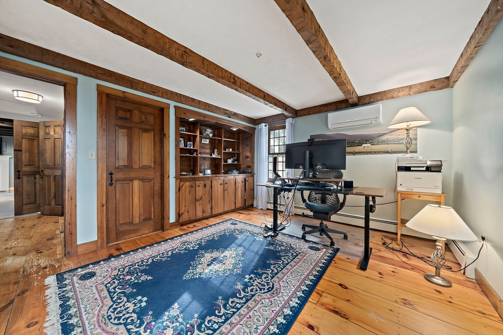 372 Winter Street Walpole, MA 02081 - Photo 16 of 42 a living room with a rug and a table