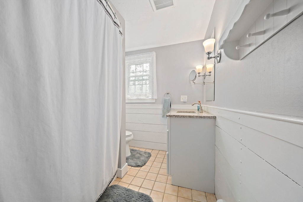 372 Winter Street Walpole, MA 02081 - Photo 23 of 42 a bathroom with a sink and a mirror