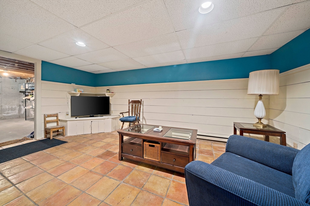 372 Winter Street Walpole, MA 02081 - Photo 27 of 42 a living room with furniture and a flat screen tv