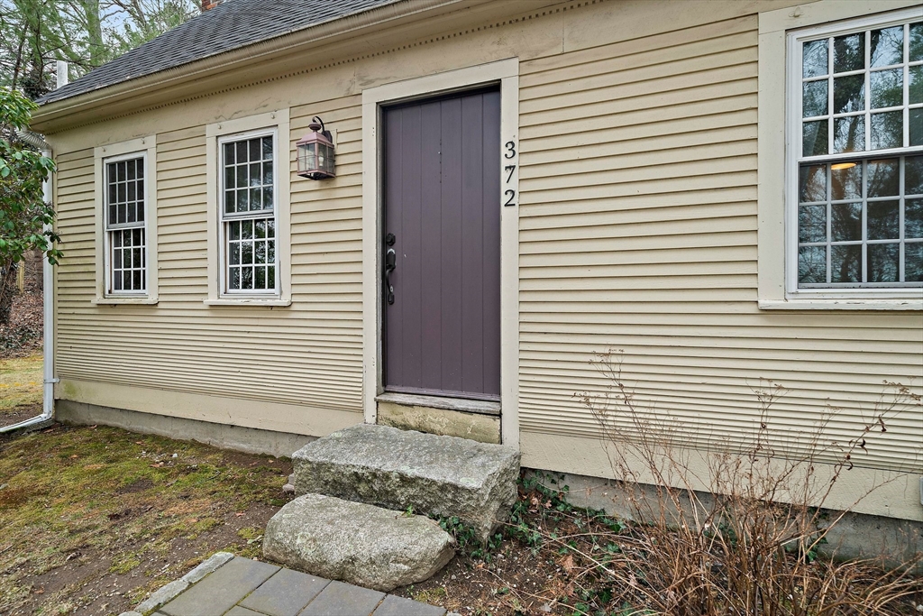 372 Winter Street Walpole, MA 02081 - Photo 3 of 42 a view of a house with a door and a window