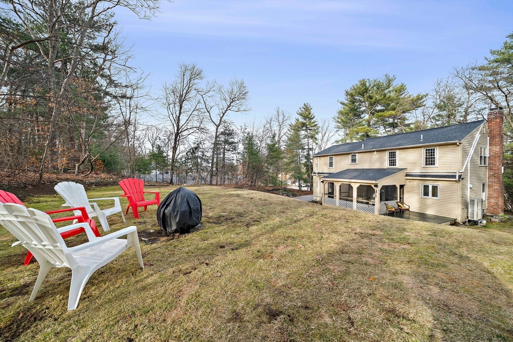 372 Winter Street Walpole, MA 02081 - Photo 33 of 42 a view of a house with a bed and a yard