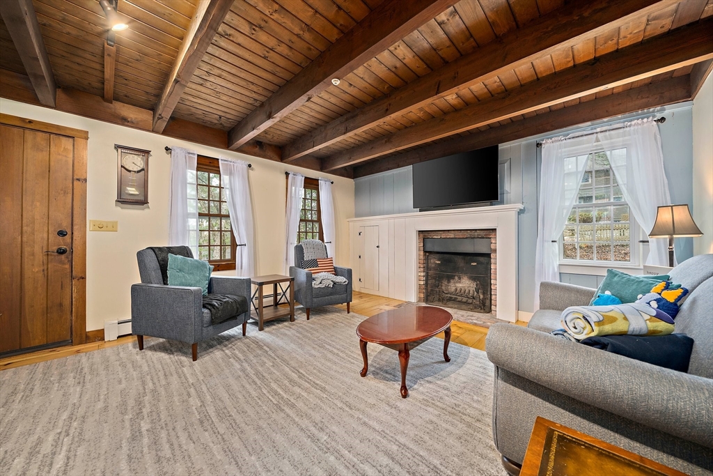 372 Winter Street Walpole, MA 02081 - Photo 9 of 42 a outdoor living space with furniture and a fireplace