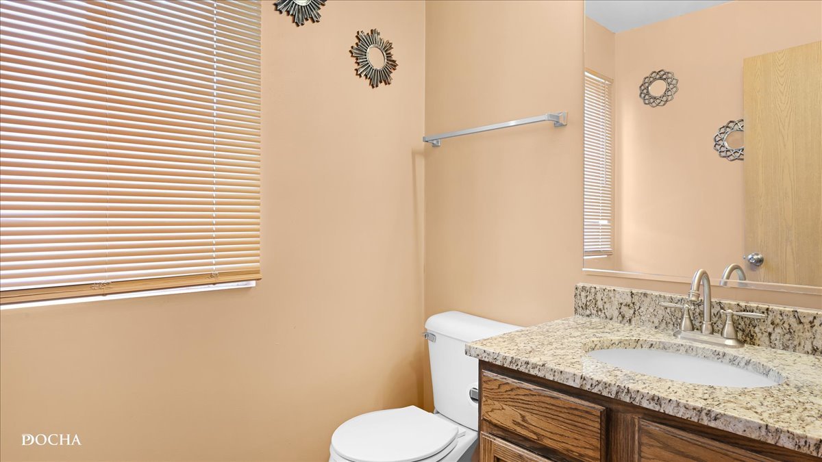 2216 Beechwood Road Joliet, IL 60432 - Photo 11 of 21 a bathroom with a granite countertop toilet sink and mirror
