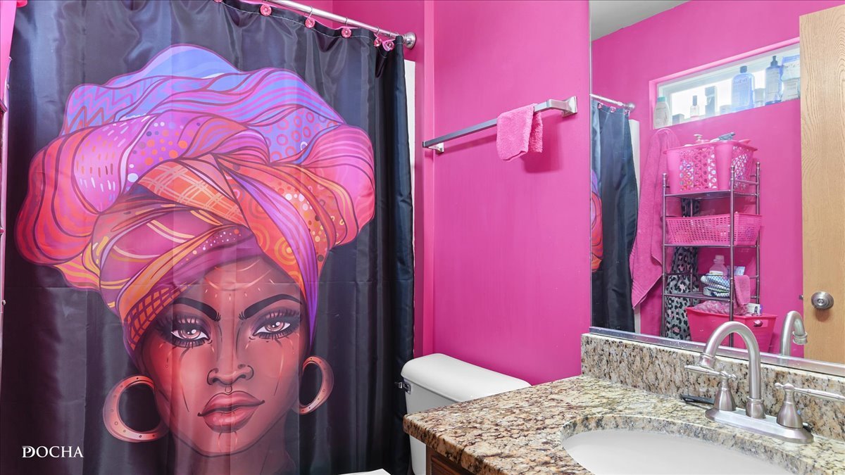 2216 Beechwood Road Joliet, IL 60432 - Photo 14 of 21 a bathroom with a sink and mirror