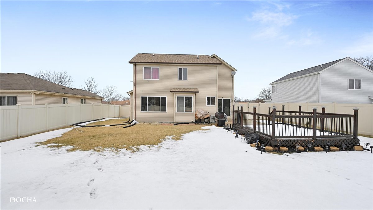 2216 Beechwood Road Joliet, IL 60432 - Photo 2 of 21 a front view of a house with a dirt yard and a large tree