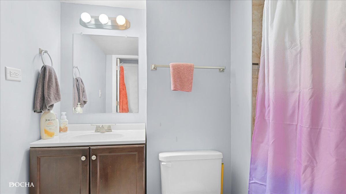 2216 Beechwood Road Joliet, IL 60432 - Photo 21 of 21 a bathroom with a sink vanity and a mirror