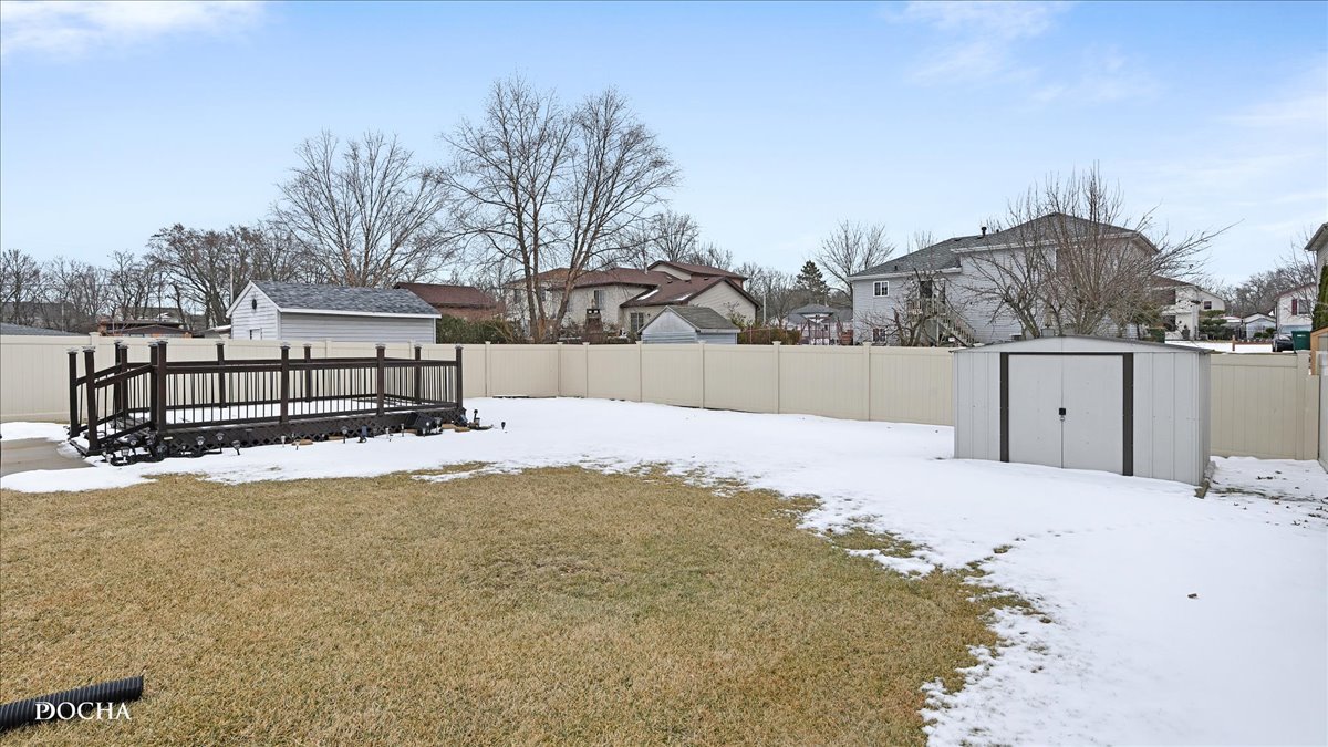 2216 Beechwood Road Joliet, IL 60432 - Photo 3 of 21 a view of a backyard of snow