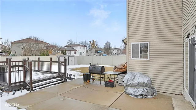 a view of a terrace with furniture and a fire pit