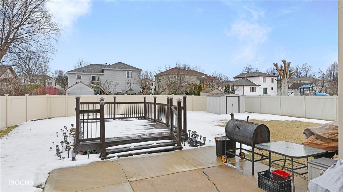 2216 Beechwood Road Joliet, IL 60432 - Photo 5 of 21 a view of a terrace with furniture and a fire pit
