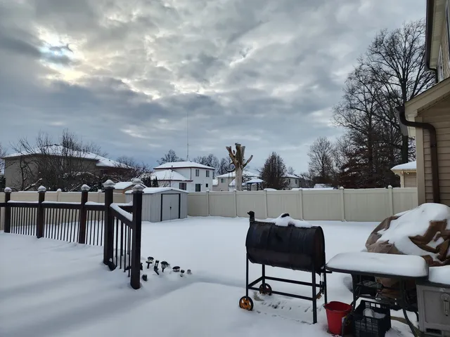 a view of a terrace with furniture and a fire pit