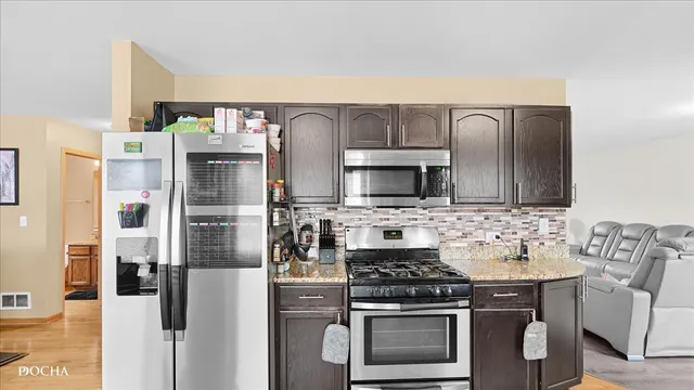a kitchen with sink and cabinets