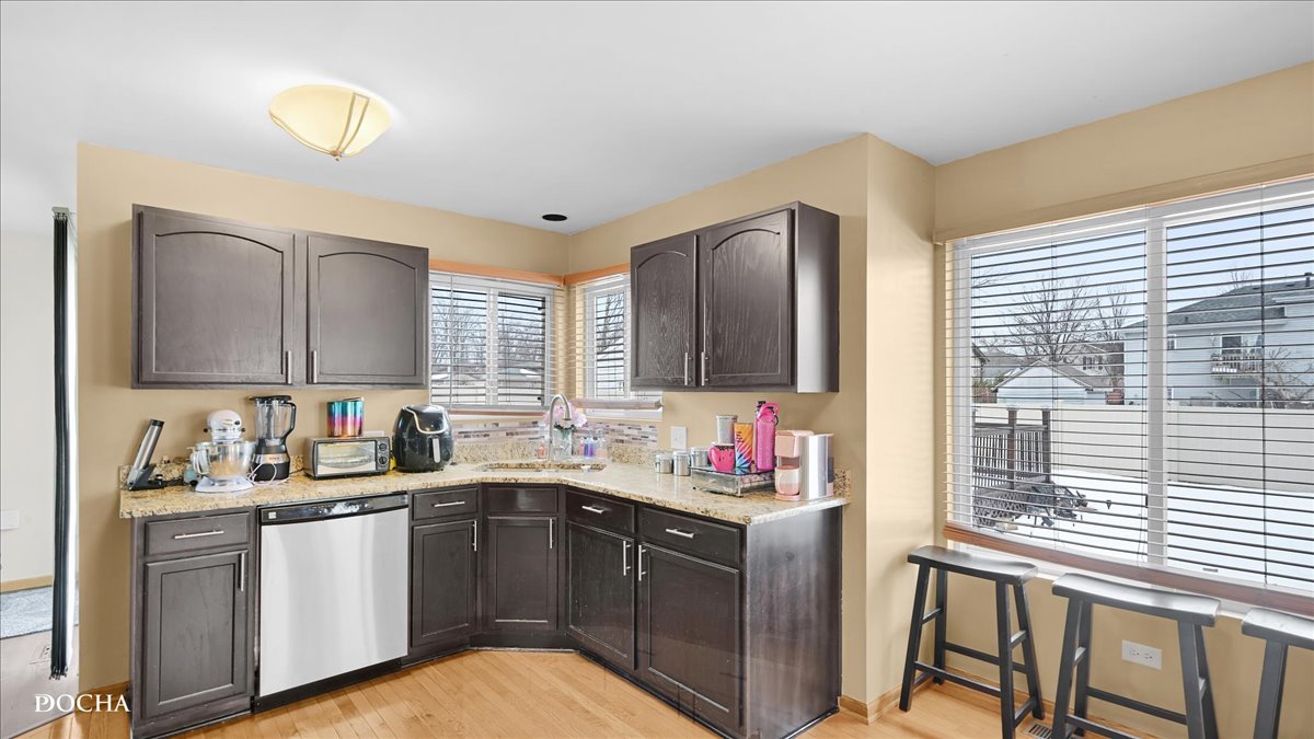 2216 Beechwood Road Joliet, IL 60432 - Photo 10 of 21 a kitchen with sink and cabinets