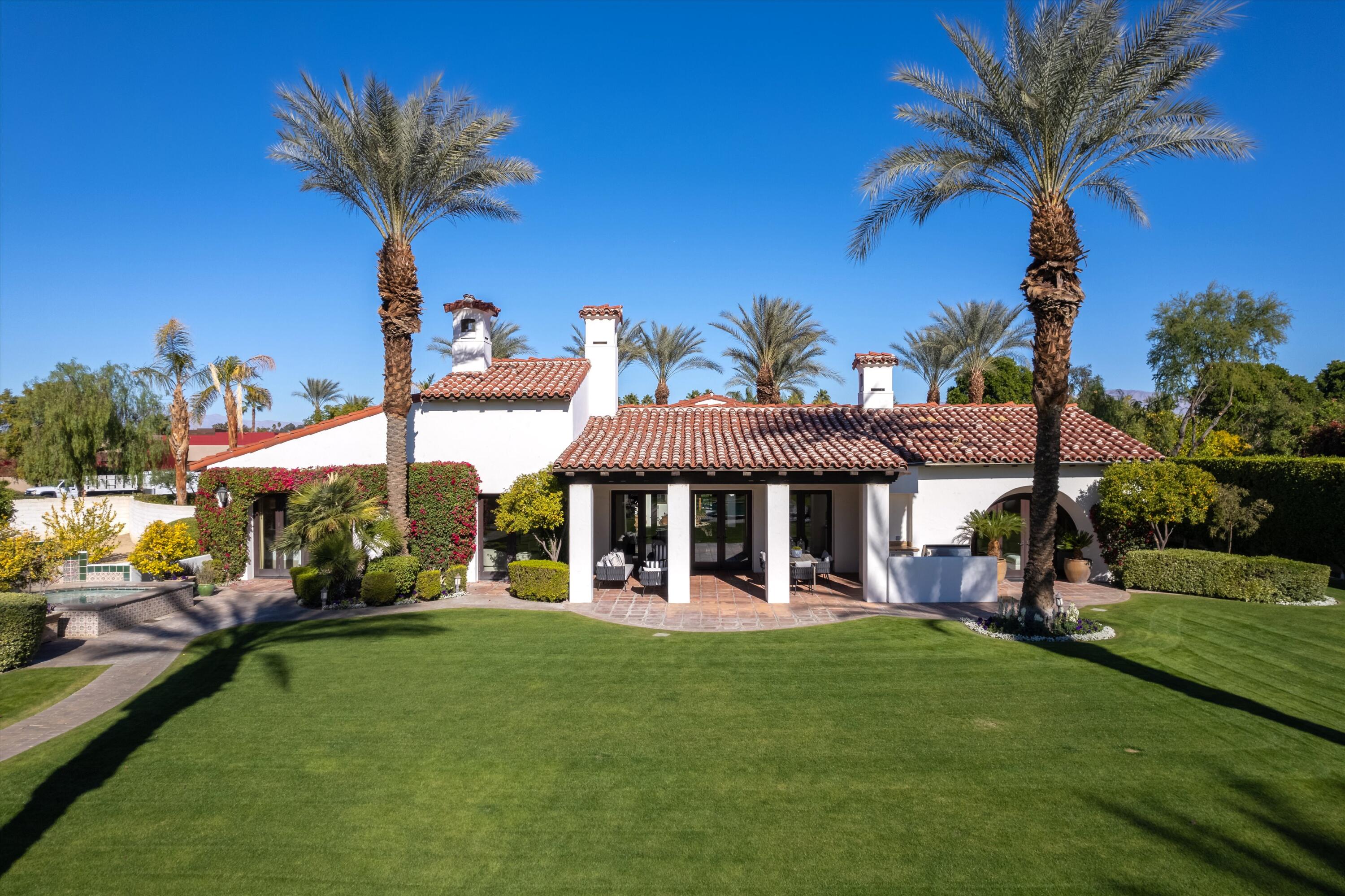 2 Serrano Way Rancho Mirage, CA 92270 - Photo 14 of 76 a view of a house with a backyard porch and sitting area