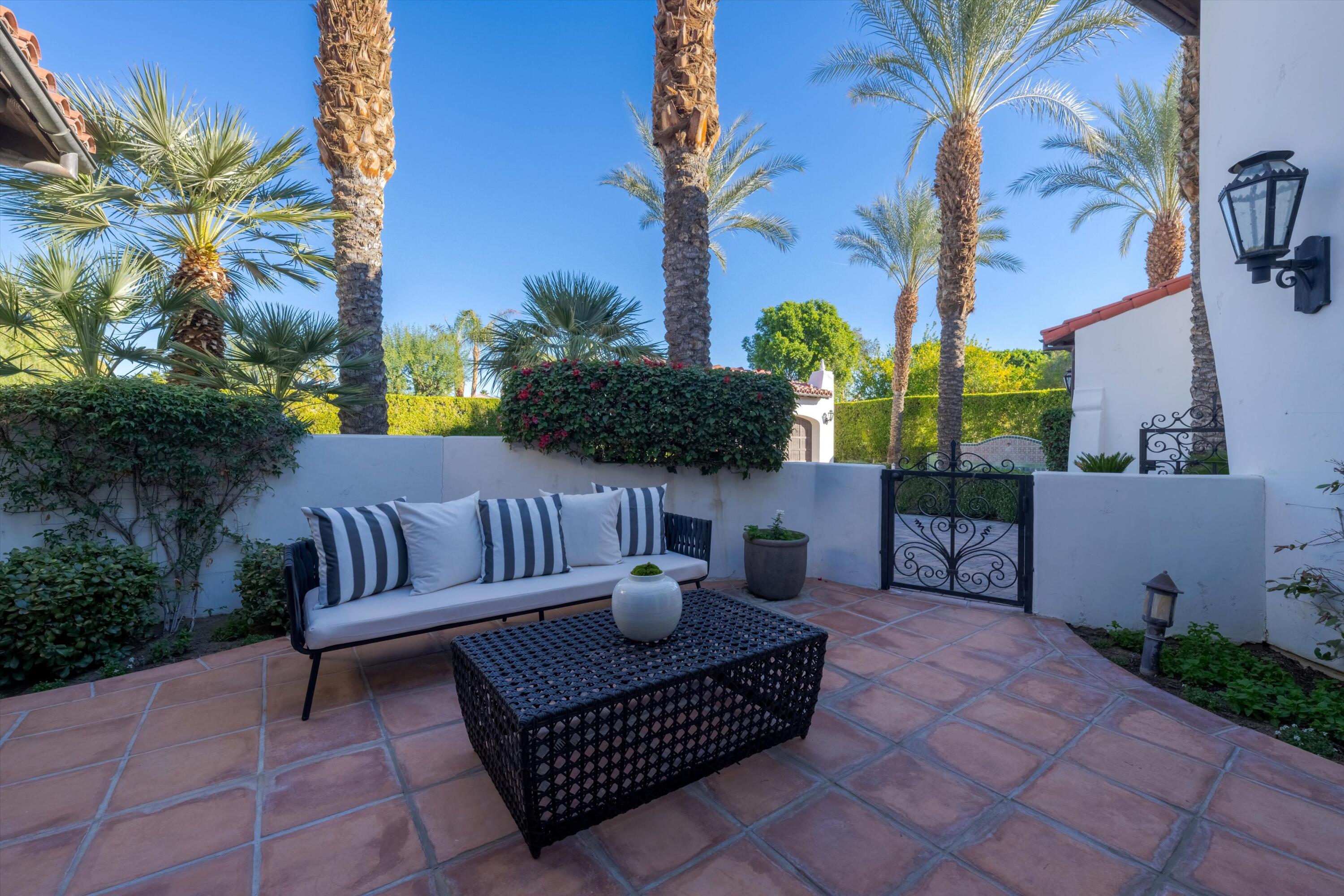 2 Serrano Way Rancho Mirage, CA 92270 - Photo 16 of 76 a view of a patio with iron fence