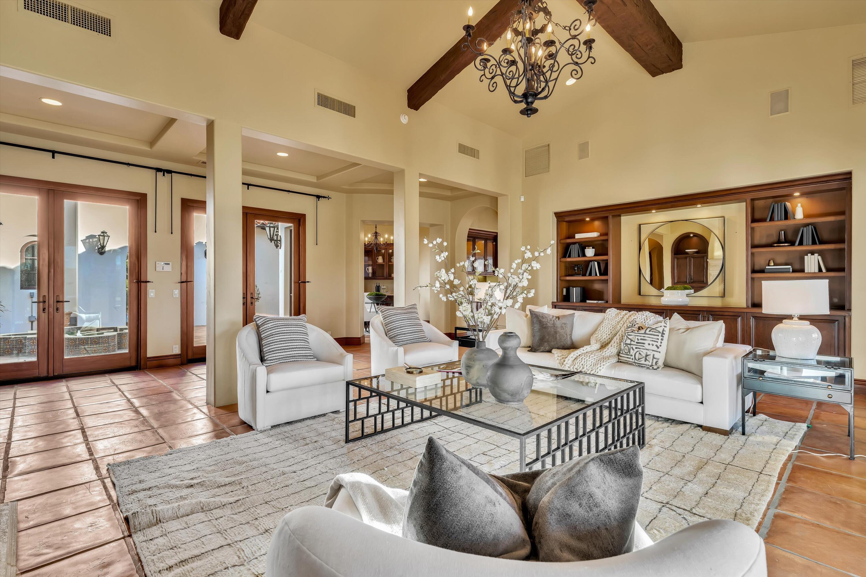 2 Serrano Way Rancho Mirage, CA 92270 - Photo 38 of 76 a living room with furniture and wooden floor