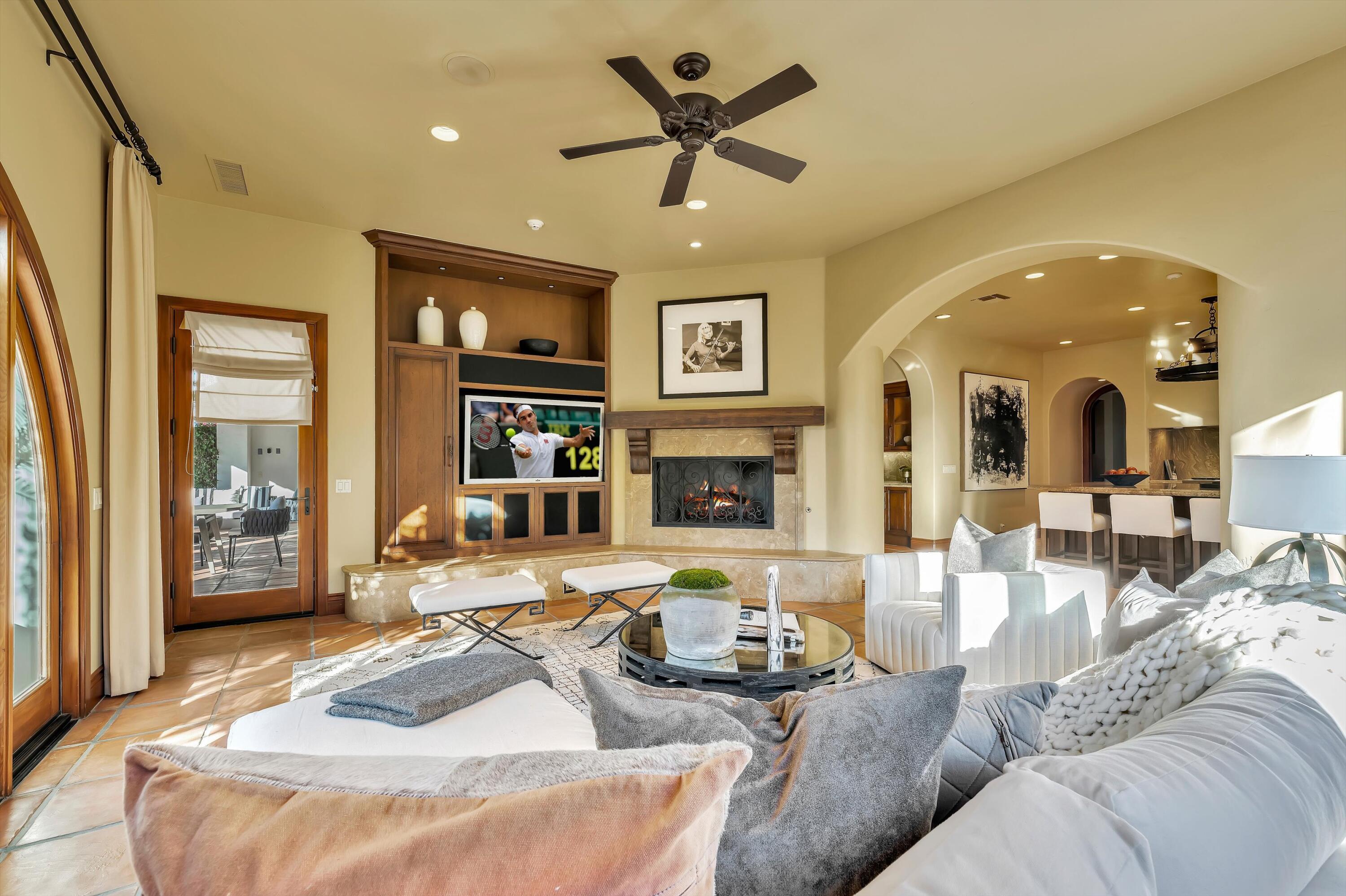 2 Serrano Way Rancho Mirage, CA 92270 - Photo 43 of 76 a living room with furniture ceiling fan and a rug
