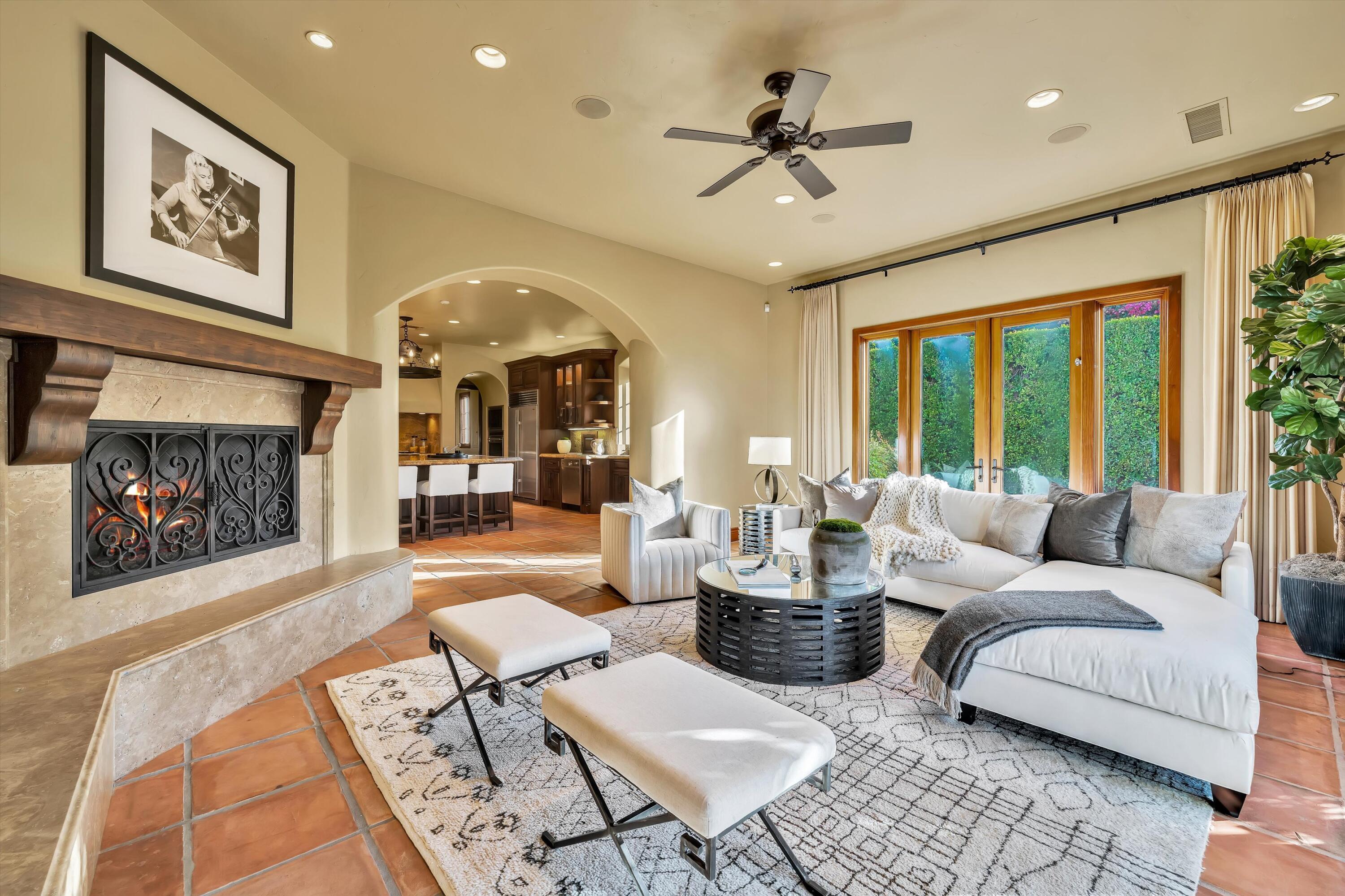 2 Serrano Way Rancho Mirage, CA 92270 - Photo 44 of 76 a living room with furniture and a fireplace