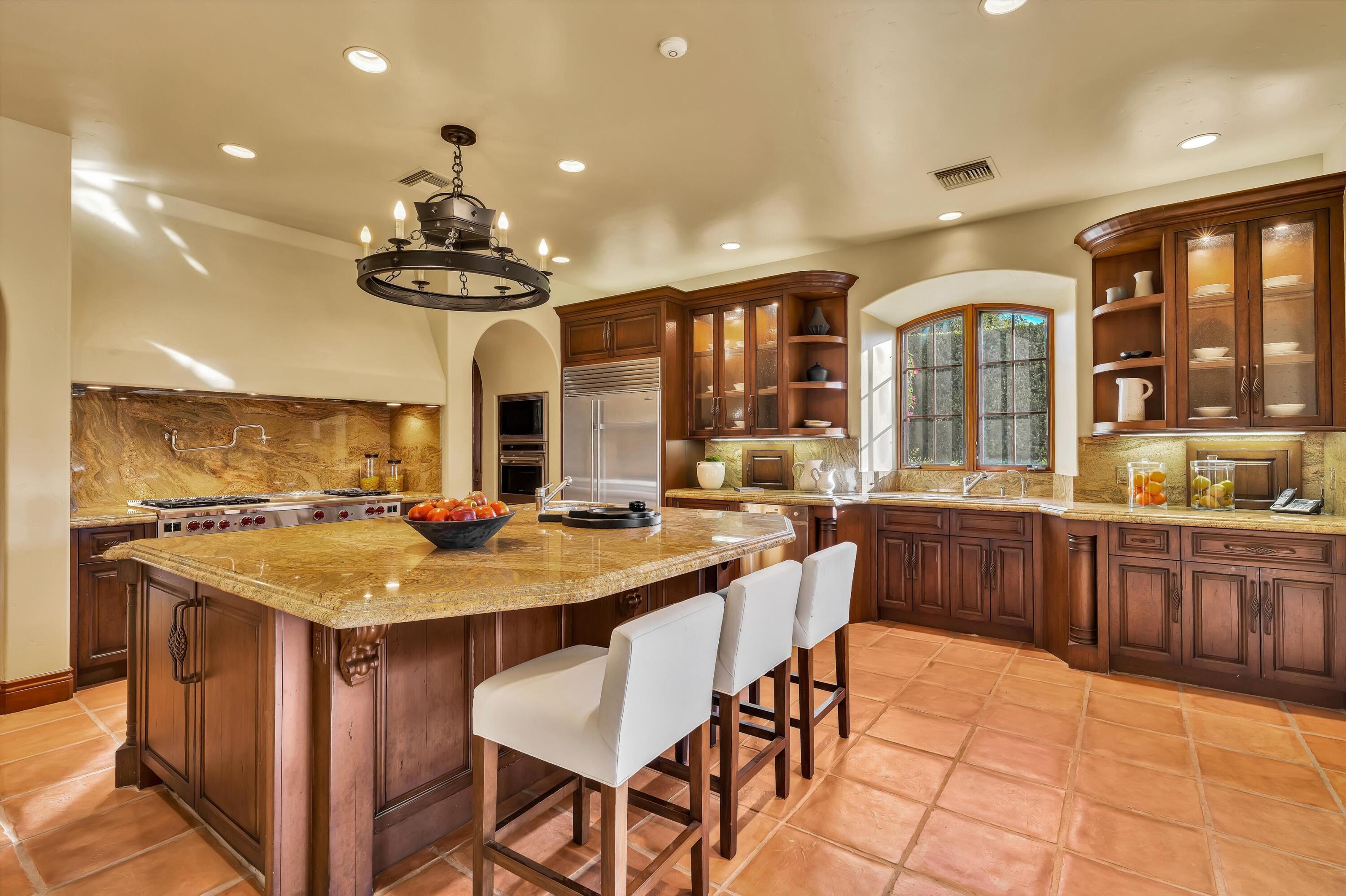 2 Serrano Way Rancho Mirage, CA 92270 - Photo 47 of 76 a kitchen with a counter space cabinets and appliances