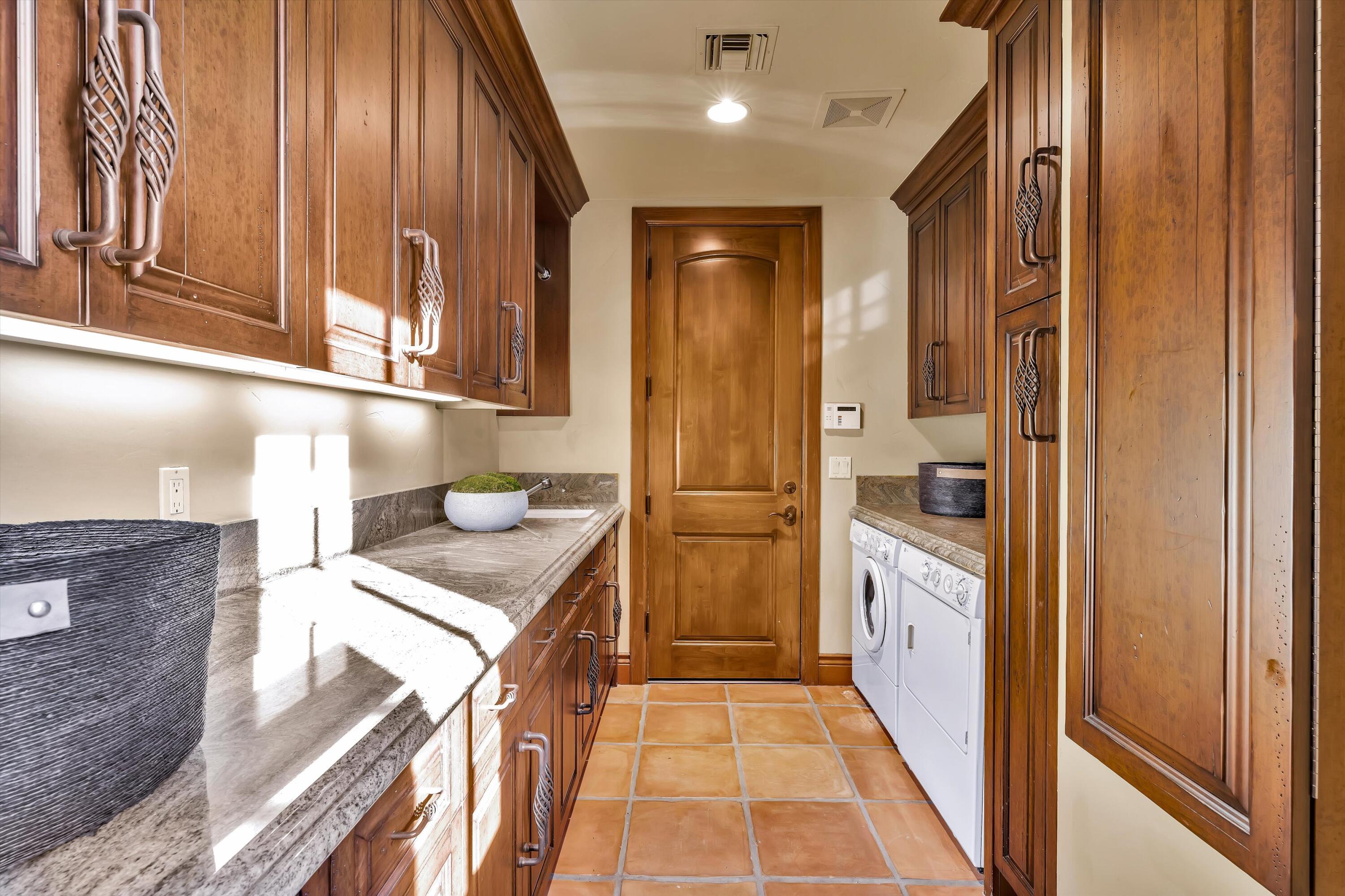 2 Serrano Way Rancho Mirage, CA 92270 - Photo 52 of 76 a bathroom with a sink a toilet and shower
