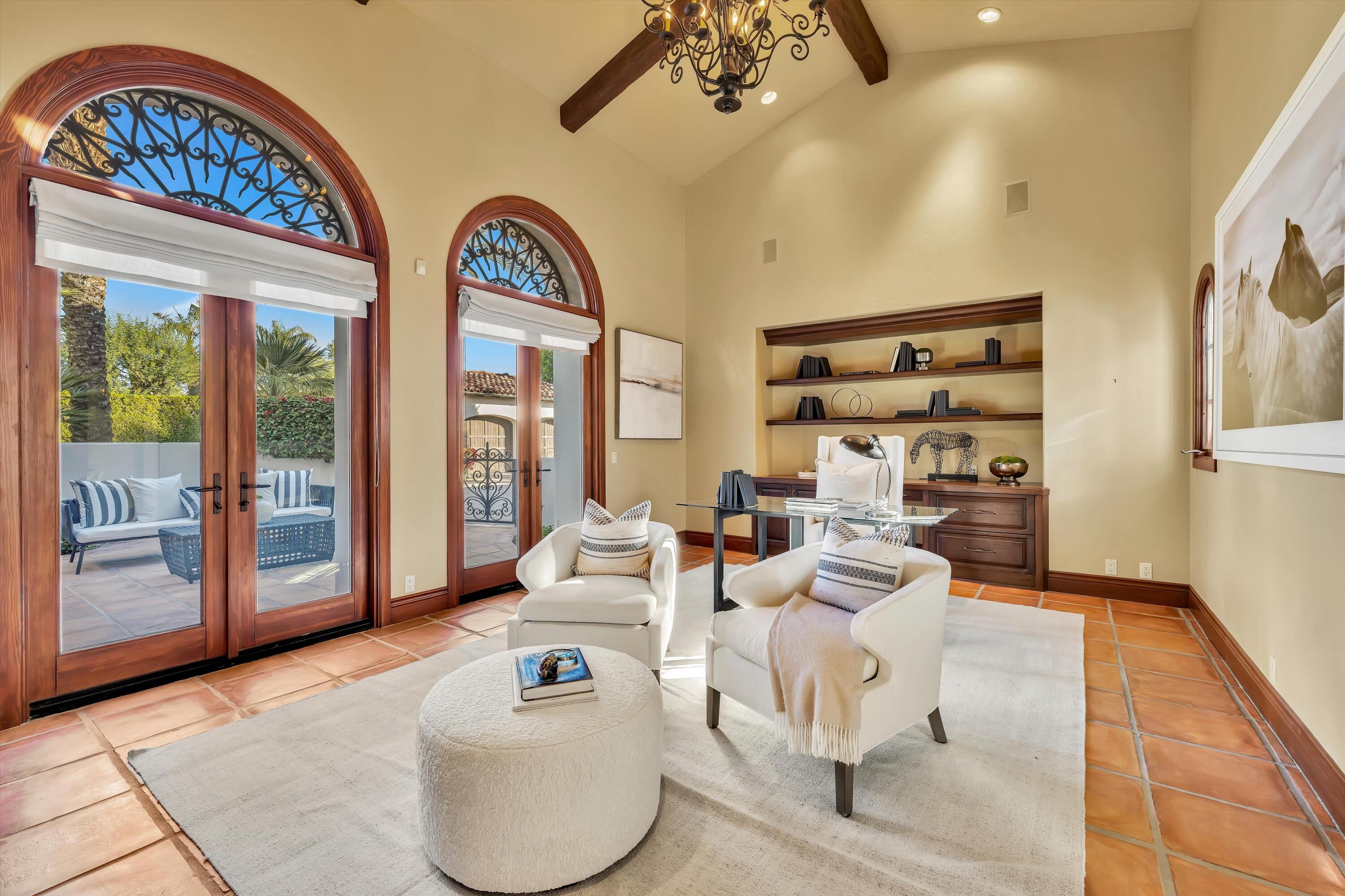 2 Serrano Way Rancho Mirage, CA 92270 - Photo 58 of 76 a living room with furniture and a floor to ceiling window