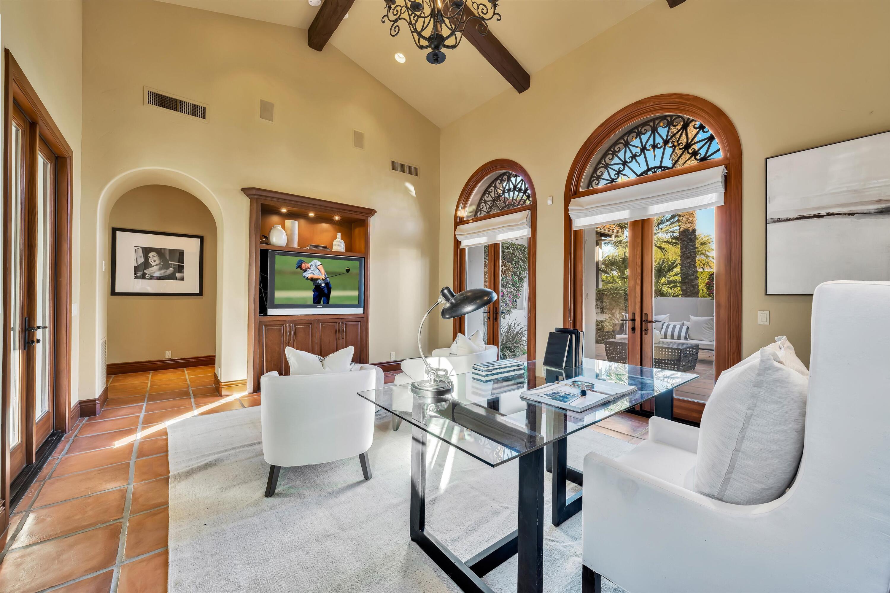 2 Serrano Way Rancho Mirage, CA 92270 - Photo 59 of 76 a living room with furniture and a large window