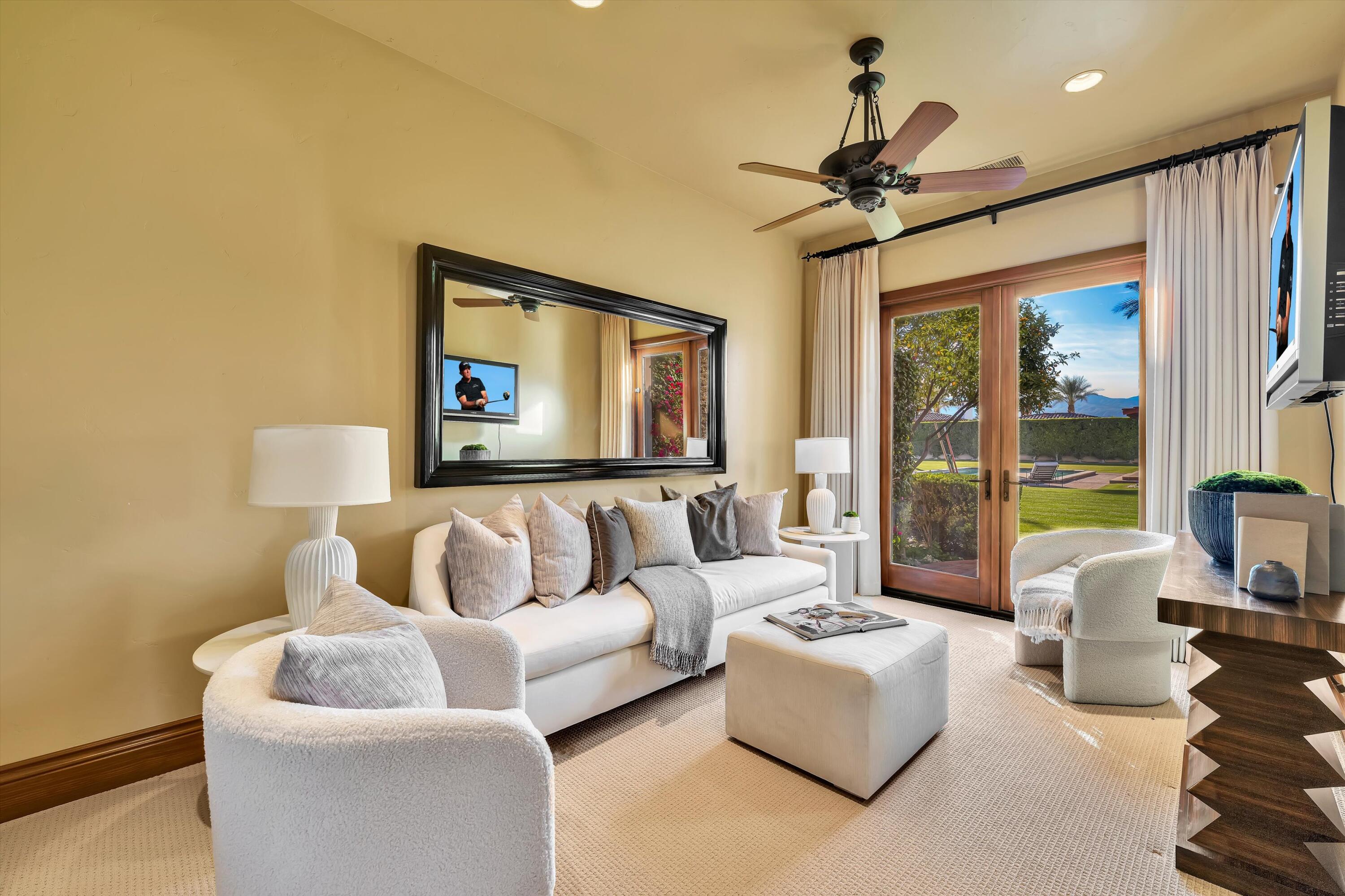 2 Serrano Way Rancho Mirage, CA 92270 - Photo 66 of 76 a living room with furniture and a large window