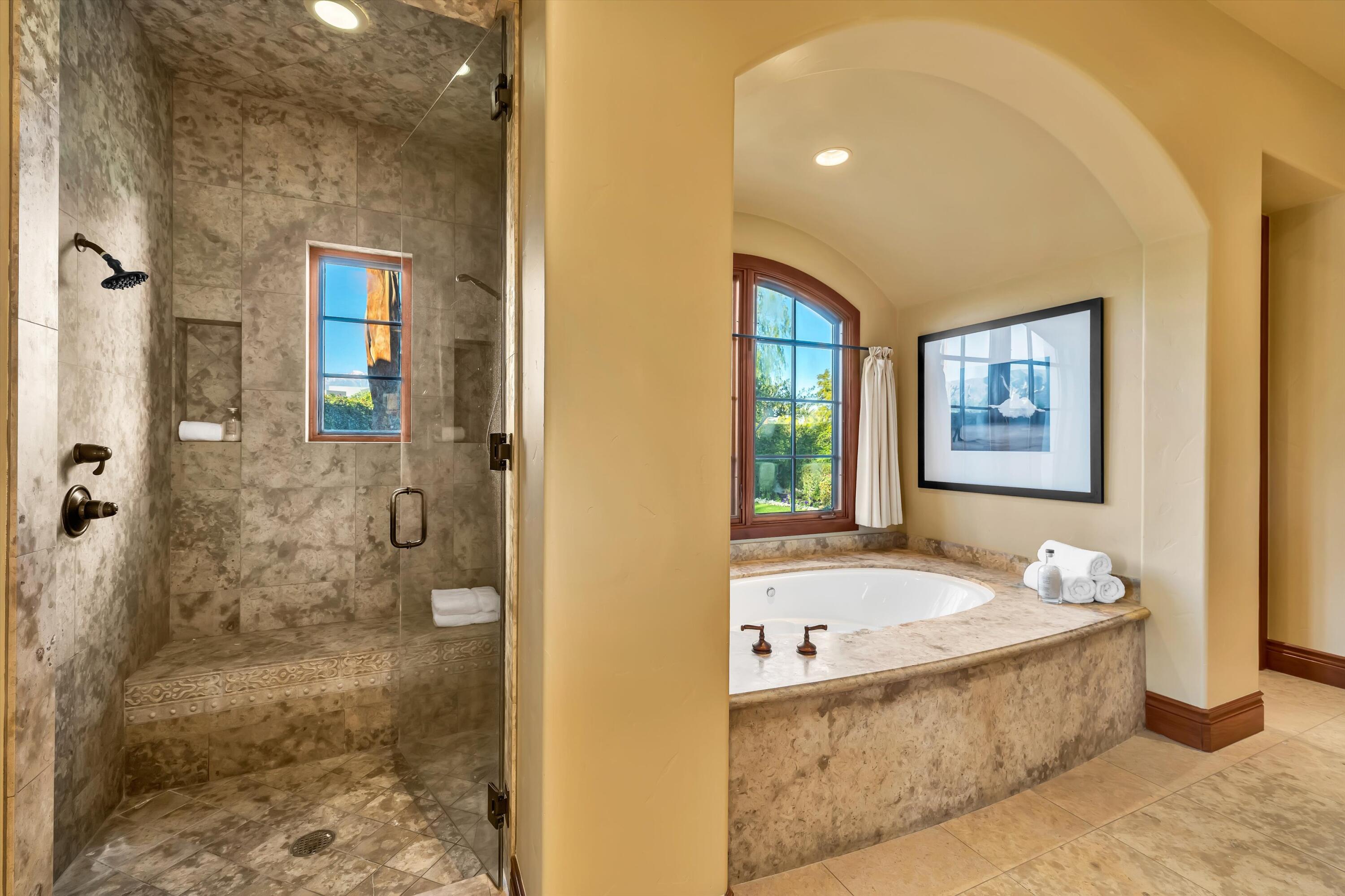 2 Serrano Way Rancho Mirage, CA 92270 - Photo 69 of 76 a bathroom with a bathtub and a shower