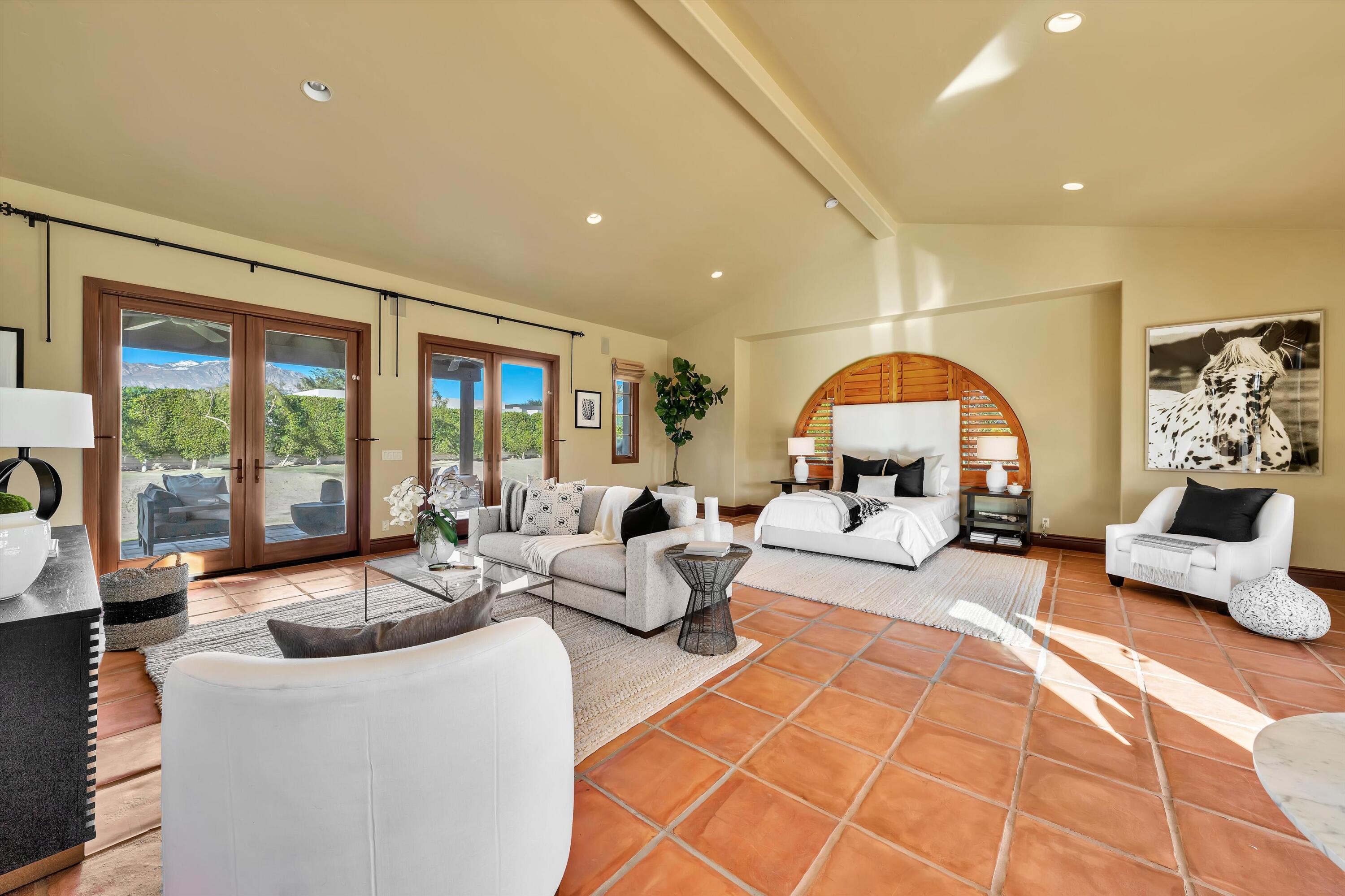 2 Serrano Way Rancho Mirage, CA 92270 - Photo 70 of 76 a living room with furniture and a fireplace