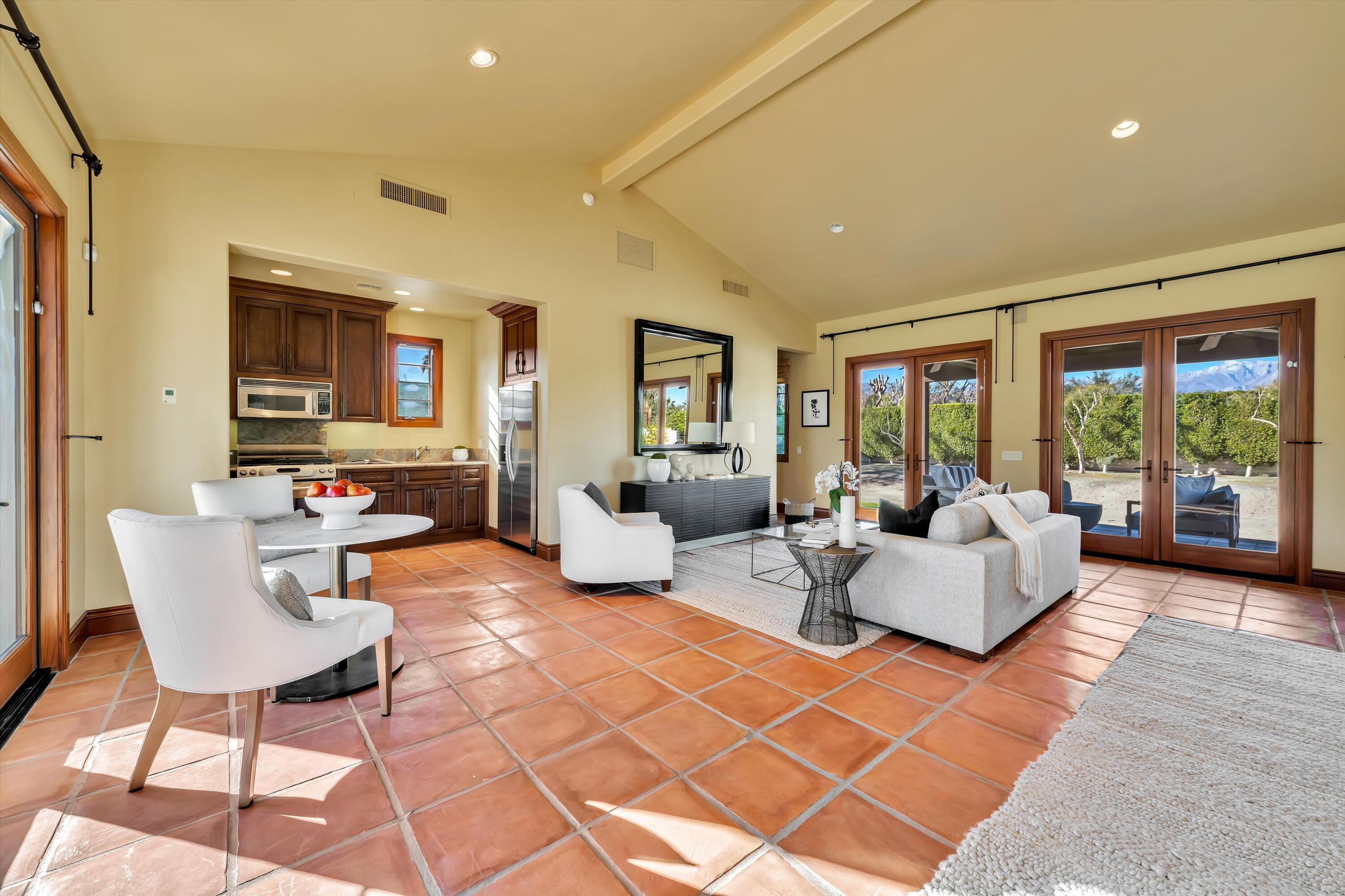 2 Serrano Way Rancho Mirage, CA 92270 - Photo 72 of 76 a living room with fireplace furniture and a table