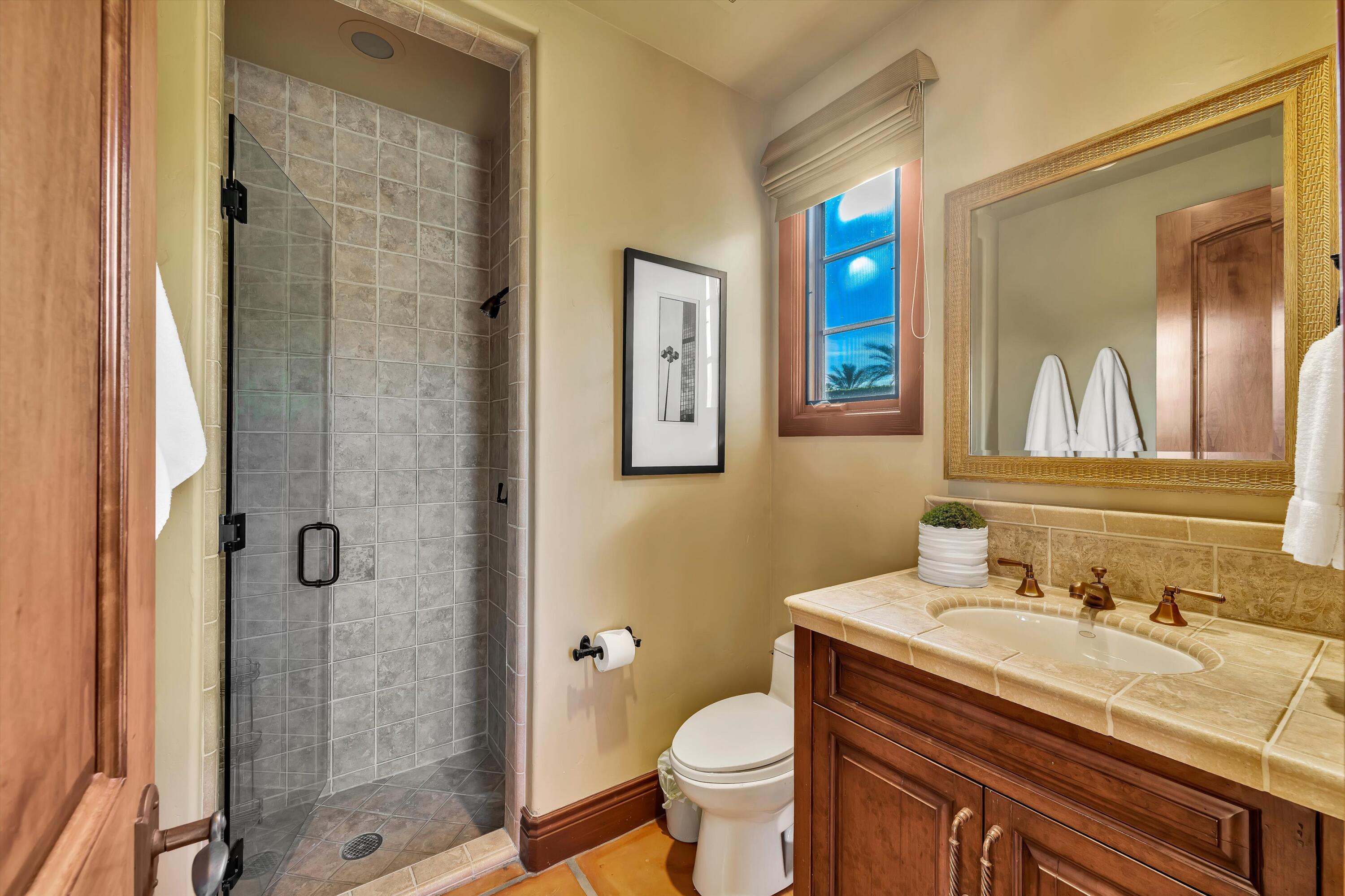 2 Serrano Way Rancho Mirage, CA 92270 - Photo 76 of 76 a bathroom with a sink and a mirror