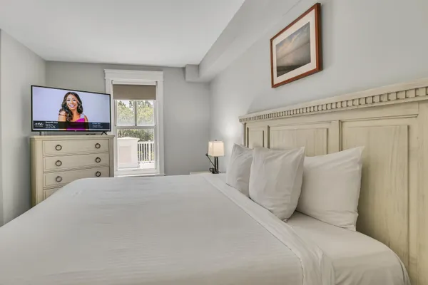 a bedroom with a bed and a cabinet