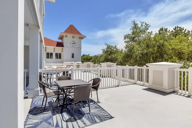 a view of a chairs and table in wooden floor