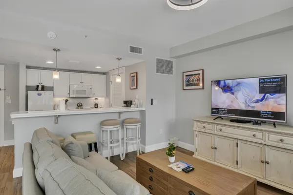 a living room with furniture and flat screen tv
