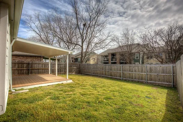 a view of a backyard with a small pool