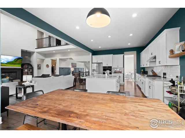 a kitchen with stainless steel appliances kitchen island granite countertop a stove and cabinets