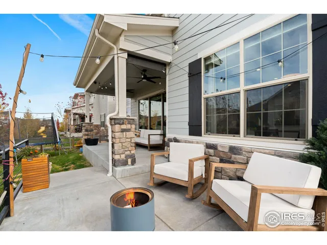 a view of living room filled with furniture and large window