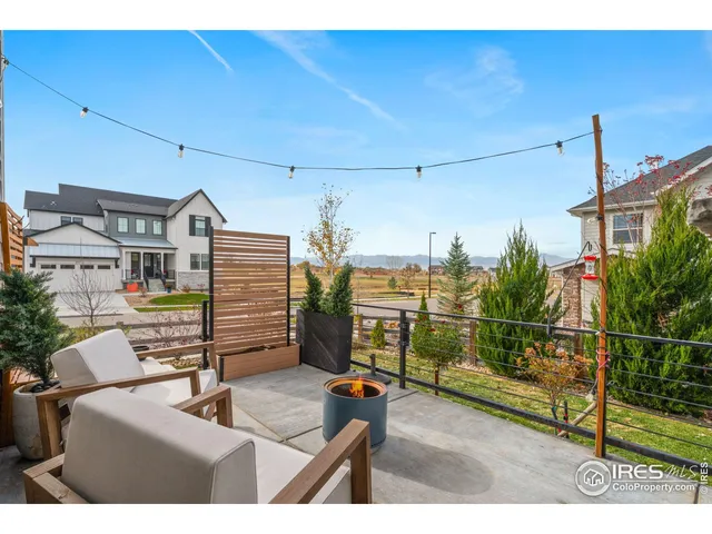 a bedroom with furniture and a potted plant