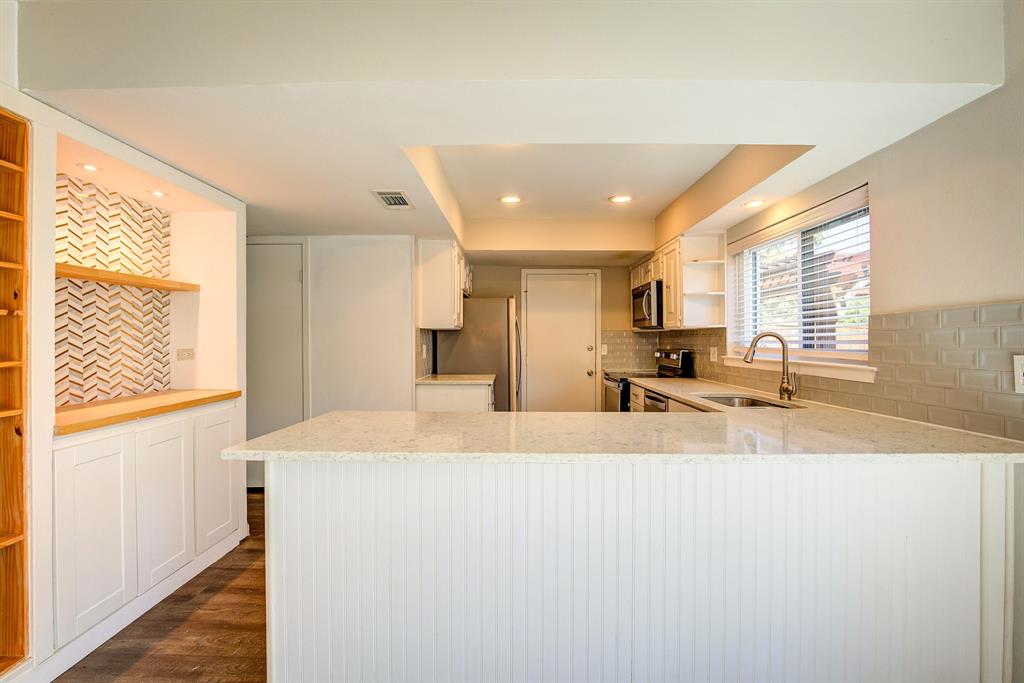 3728 Blue Bonnet Court Flower Mound, TX 75028 - Photo 15 of 40 a large white kitchen with a large window