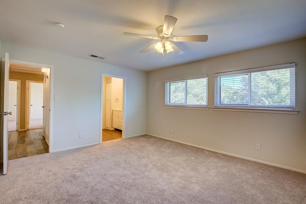 3728 Blue Bonnet Court Flower Mound, TX 75028 - Photo 24 of 40 an empty room with windows and fan