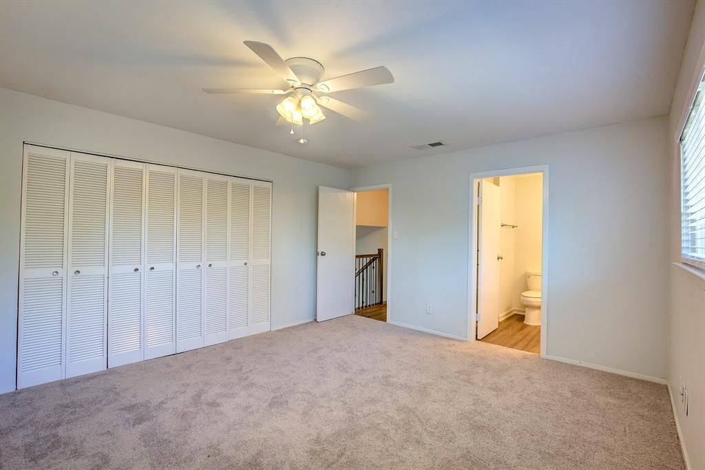 3728 Blue Bonnet Court Flower Mound, TX 75028 - Photo 25 of 40 a view of a big room with closet and a chandelier fan