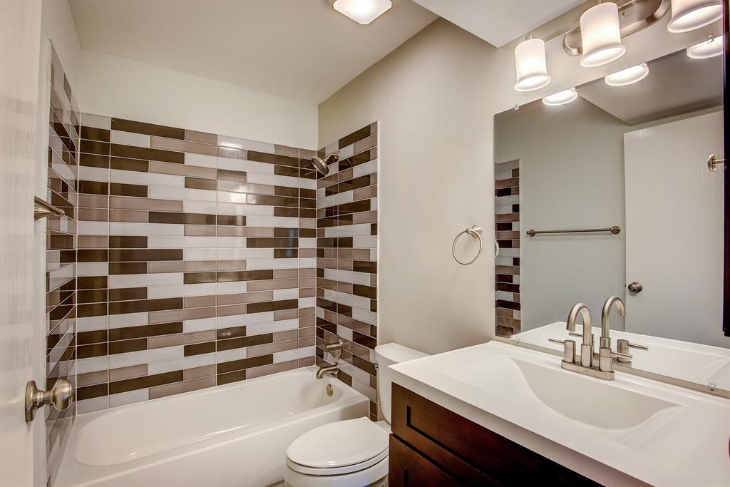 3728 Blue Bonnet Court Flower Mound, TX 75028 - Photo 29 of 40 a bathroom with a sink a toilet a mirror and shower