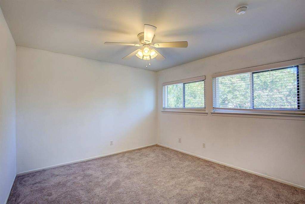 3728 Blue Bonnet Court Flower Mound, TX 75028 - Photo 30 of 40 an empty room with a window and a fan