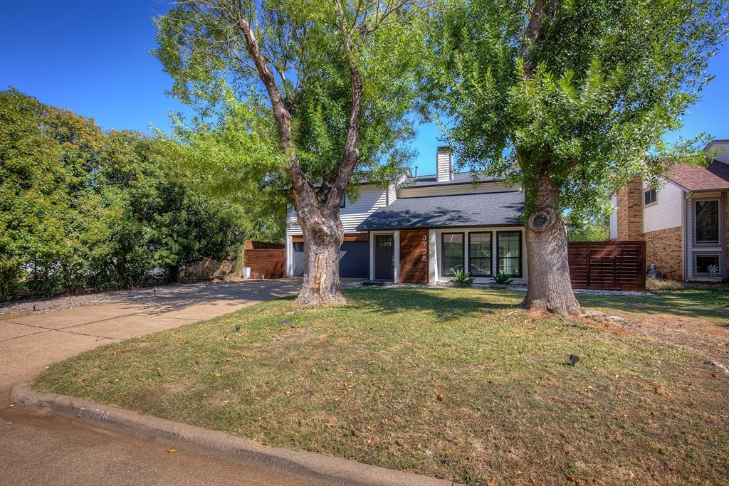 3728 Blue Bonnet Court Flower Mound, TX 75028 - Photo 3 of 40 a front view of a house with a garden