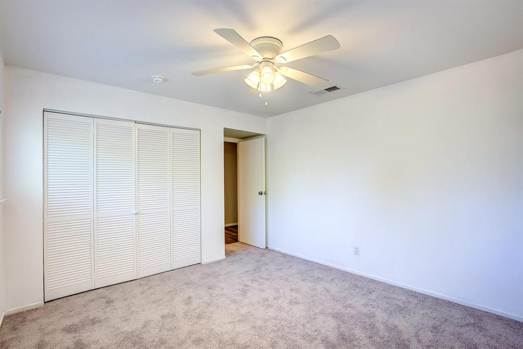 3728 Blue Bonnet Court Flower Mound, TX 75028 - Photo 31 of 40 an empty room with closet and a chandelier fan