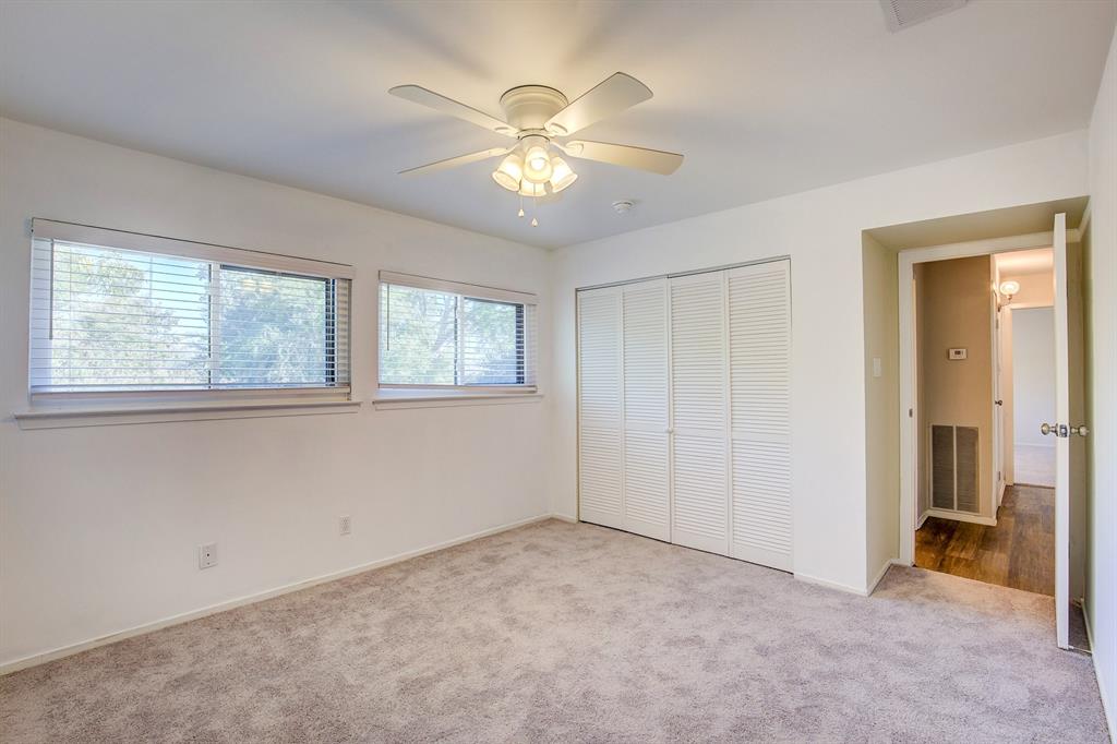 3728 Blue Bonnet Court Flower Mound, TX 75028 - Photo 32 of 40 a view of an empty room with window and chandelier fan