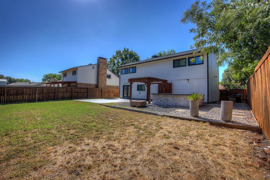 3728 Blue Bonnet Court Flower Mound, TX 75028 - Photo 37 of 40 a front view of a house with garden