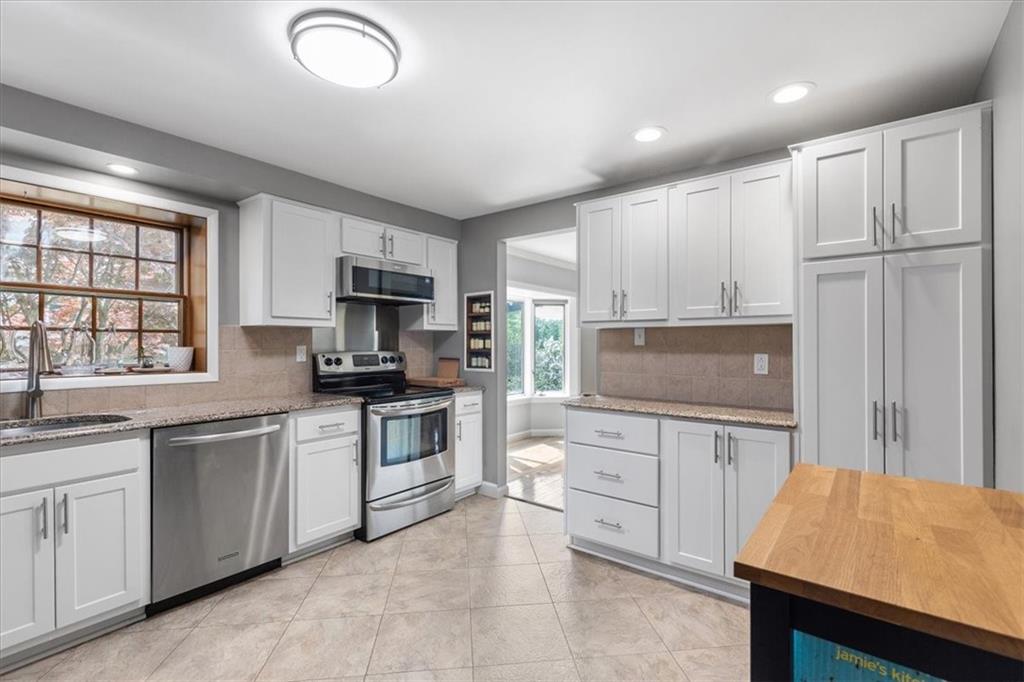 1220 Rolling Meadow Road Pittsburgh, PA 15241 - Photo 12 of 46 a kitchen with white cabinets and sink