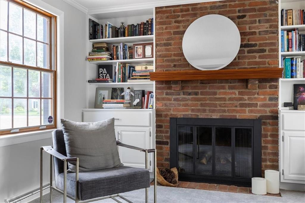 1220 Rolling Meadow Road Pittsburgh, PA 15241 - Photo 14 of 46 a living room with a bookshelf and a fireplace