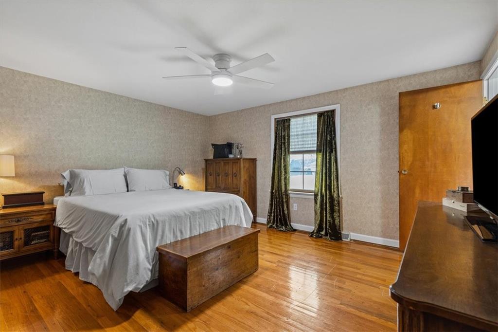 1220 Rolling Meadow Road Pittsburgh, PA 15241 - Photo 24 of 46 a spacious bedroom with a bed and a flat screen tv